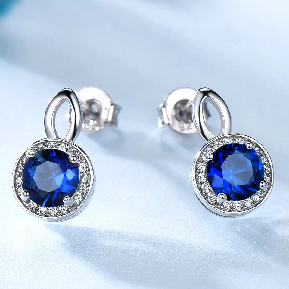 Серьги гвоздики женские круглые из серебра 925 пробы с синим