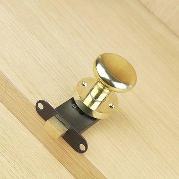 

The golden ball lock without key lock with the single contact handle lock door lock wall of dark background