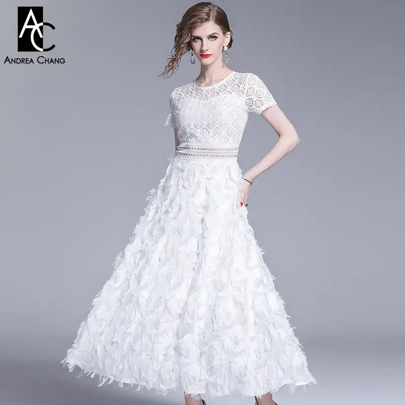 white dress with tassels on bottom