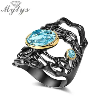 

Mytys Black Gun Color Ring Hollow Design Antique Gothic Jewelry Ocean Blue Crystal Ring for Women Statement Cocktail Ring R2139