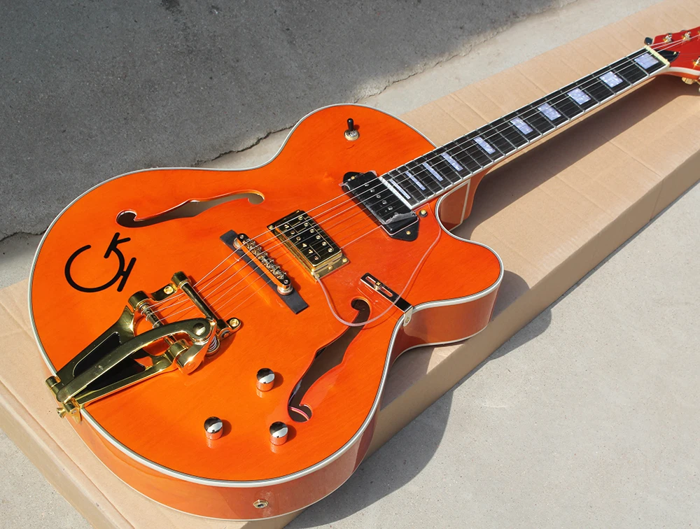 

Factory Orange Semi-Hollow Electric Guitar with Transparent Pickguard,Tremolo System,,Gold Hardware,Can be customized
