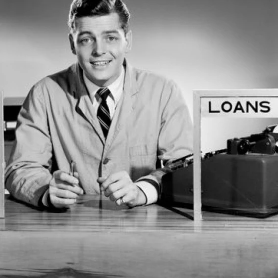 Young man in loans office Poster Print (18 x 24)