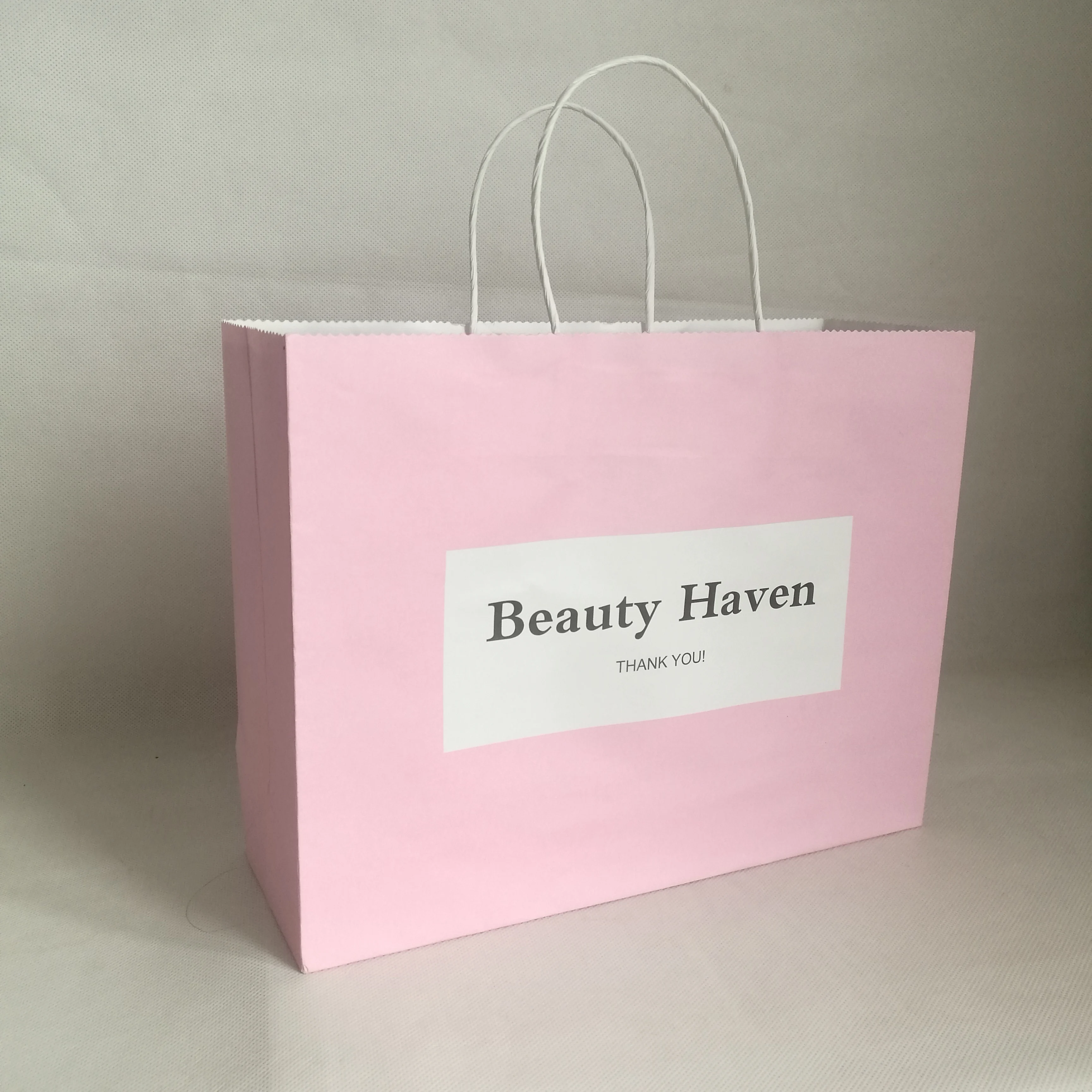 

Wholesale 500pcs/lot Kraft paper shopping bags customized logo clothes with handle fashion jewelry gift advertising bags