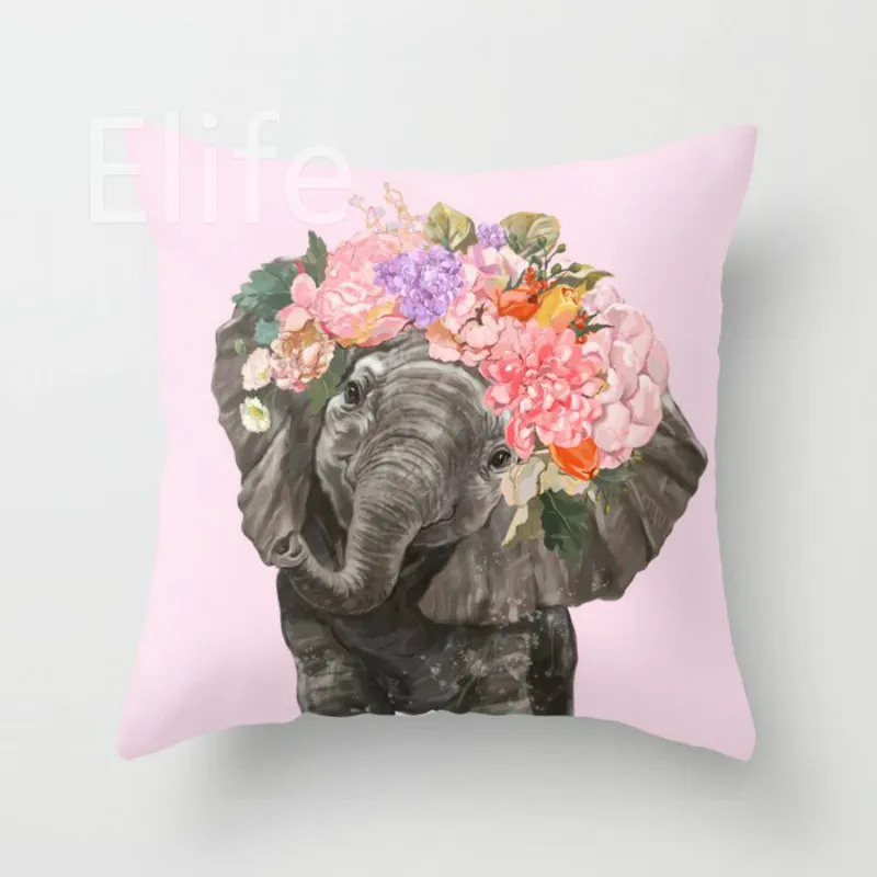 baby-elephant-with-flower-crown-in-pink-pillows