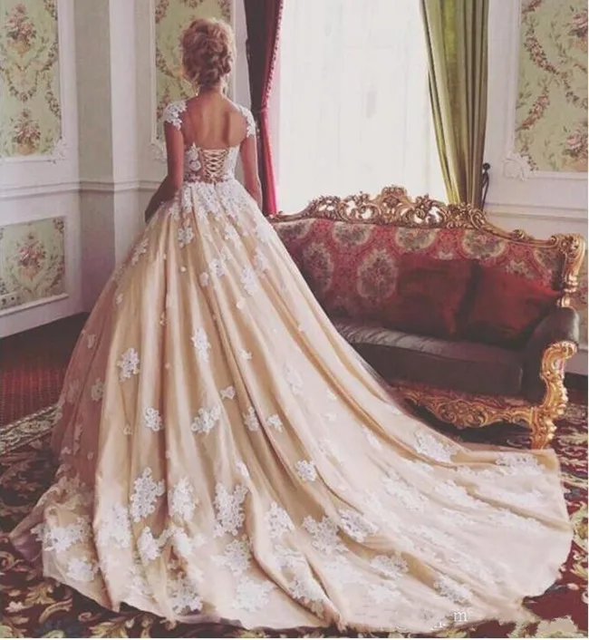 gorgeous-ball-gown-garden-wedding-dresses-new-2019-sheer-jewel-neck-lace-applique-cap-sleeve-plus-size-court-train-arabic-dubai-bridal-gowns (2)