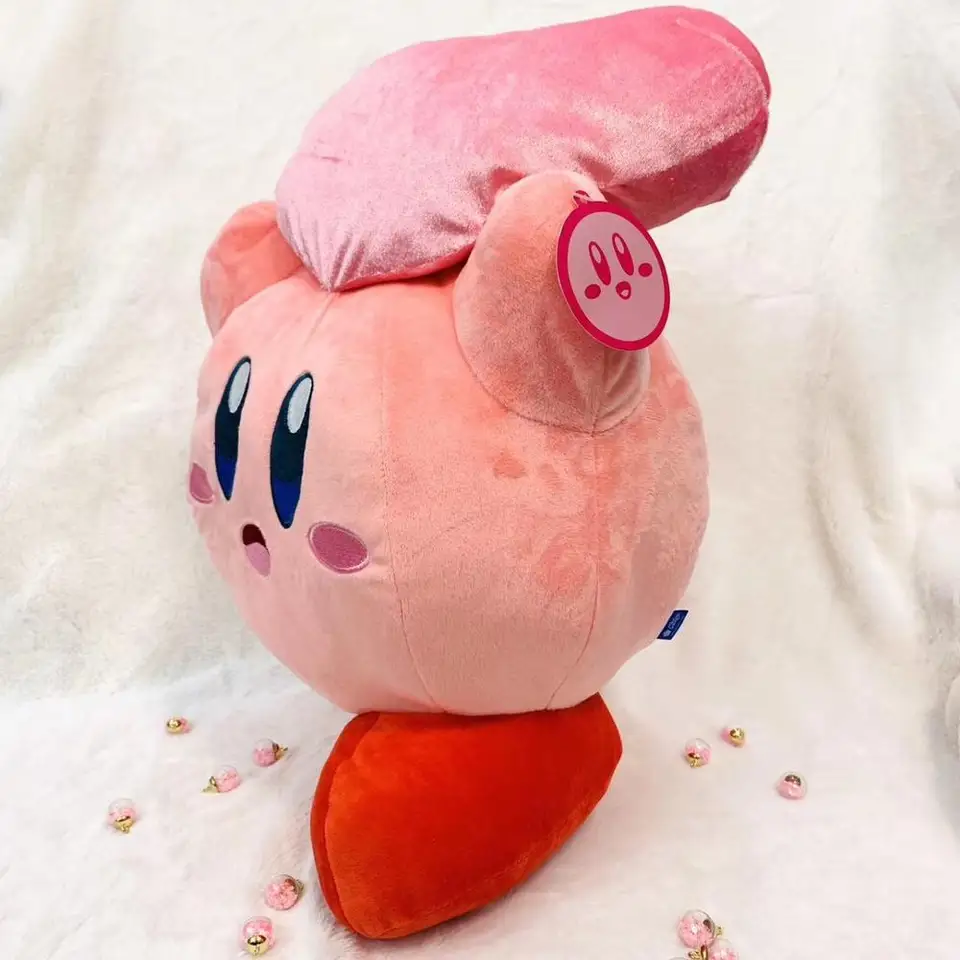 kirby holding heart plush