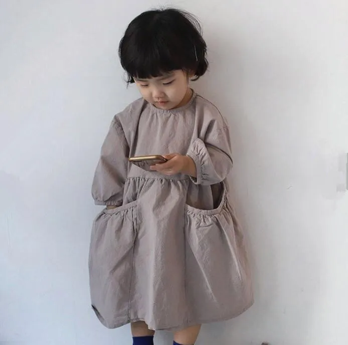 

2019 Korean autumn girls cotton and hemp girls big pocket long sleeves leisure dress