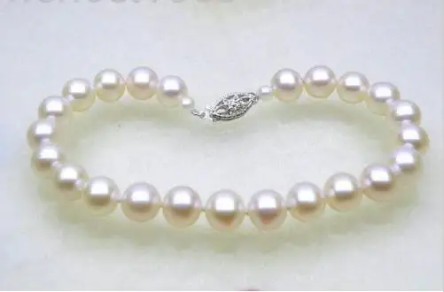 

Shipping >>>>> Gorgeous 7.5-8mm AAA+ round white akoya pearl bracelet 7.5" 14k solid gold