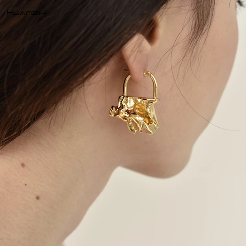 

HUANZHI 2019 New Korean Irregular Geometric Bag Type Fold Lava Retro Golden Metal Stud Earrings for Women Girls Party Gift