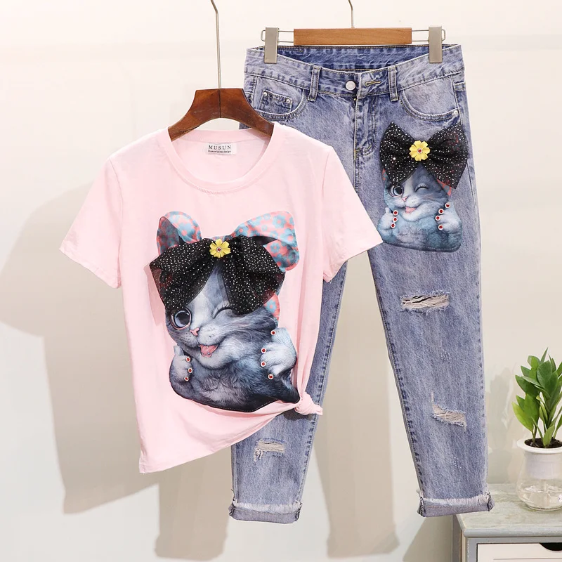 

Spring Summer 2019 New Drill-in Cartoon Cat Short-sleeved T-shirt + Hole Nine-cent Jeans Suit Women's Two Piece Sets Outwears