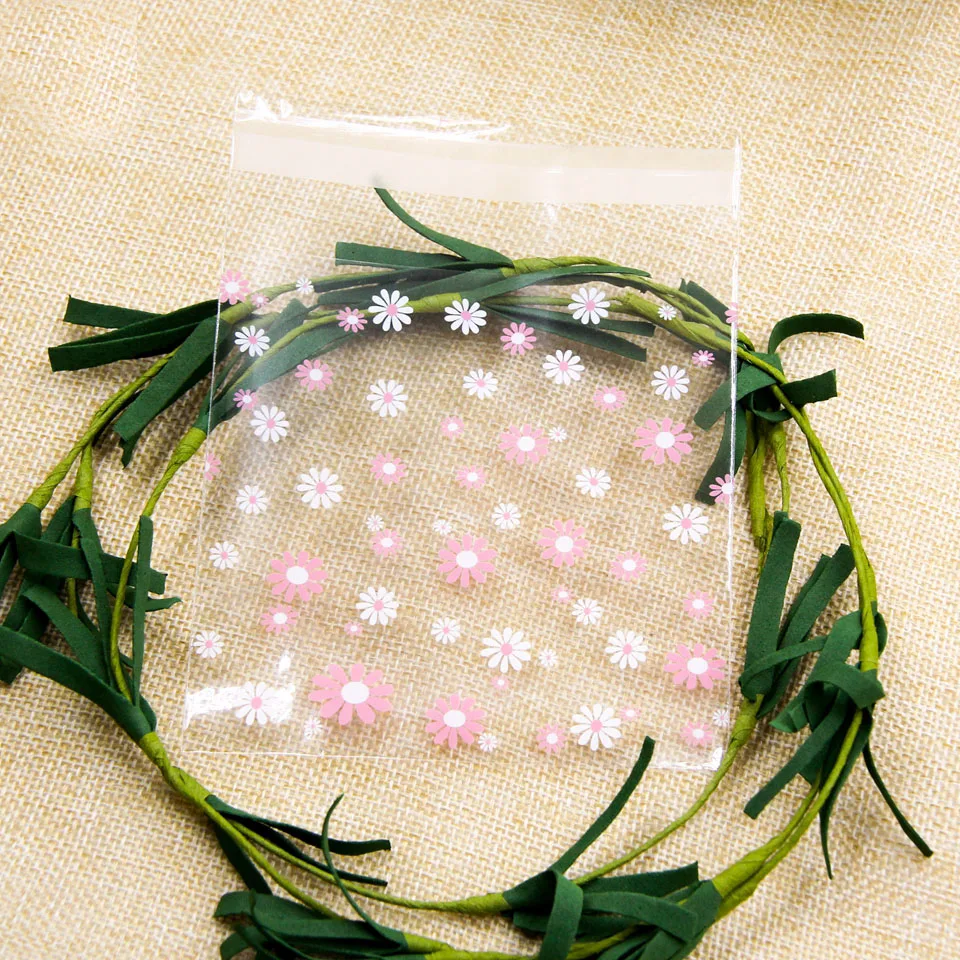 thumbnail image 1 of 100 bolsas de plástico autoadhesivas con forma de flor de cerezo para galletas y dulces, para hacer tú mismo galletas, bocadillos, repostería, decoración, regalos para niños, 1 of 5