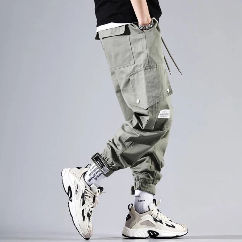 

Fashion Streetwear Men Jeans Loose Fit Big Pocket Cargo Pants Men Harem Trousers Slack Bottom Designer Hip Hop Joggers Pants