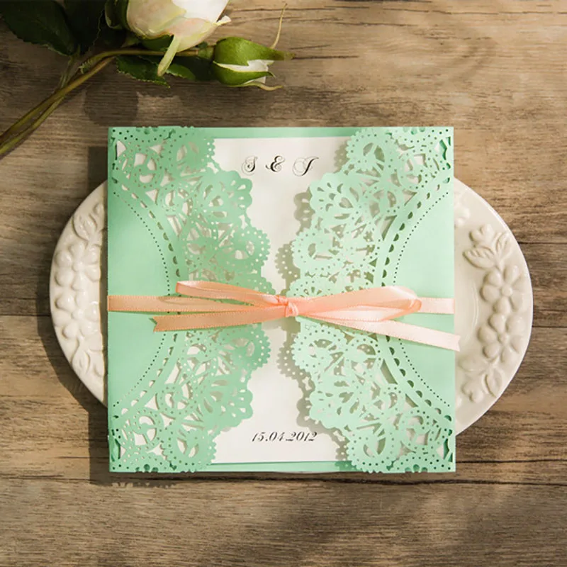 affordable-mint-and-peach-ribbon-laser-cut-wedding-invites