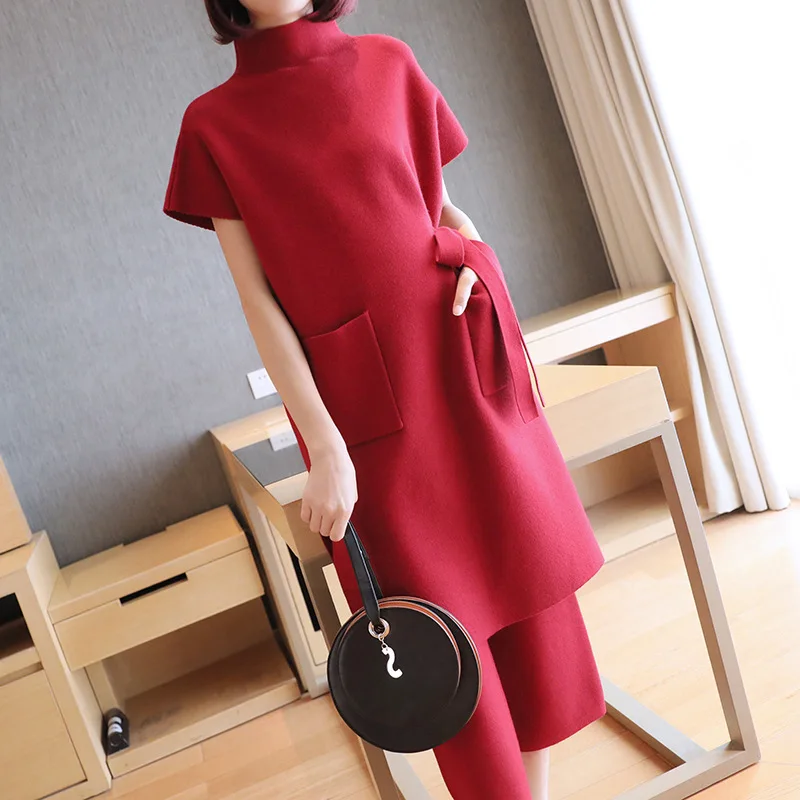 Herfst En Winter Nieuwe Mode Vrouwen Pak Gebreide Koreaanse Riem Korte Mouwen Lange Tops En Broek Elegante Gebreide Tweedelige set AA4555 Herfst En Winter Nieuwe Mode Vrouwen Pak Gebreide Koreaanse Riem Korte Mouwen Lange Tops En Broek Elegante Gebreide Tweedelige set AA4555