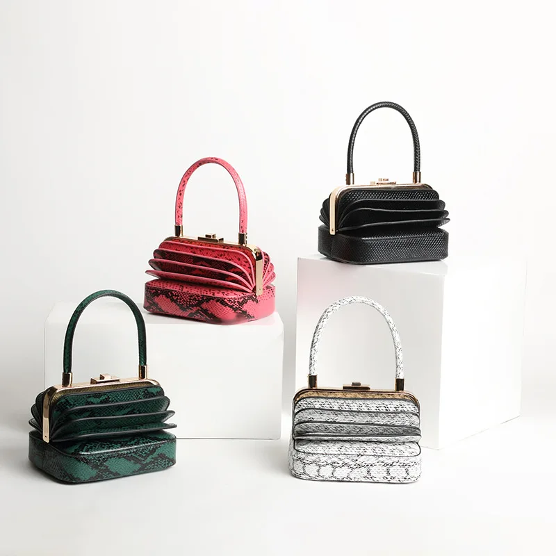 

2019 new serpentine custom personality design catwalk niche models retro unique portable organ genuine leather handbags