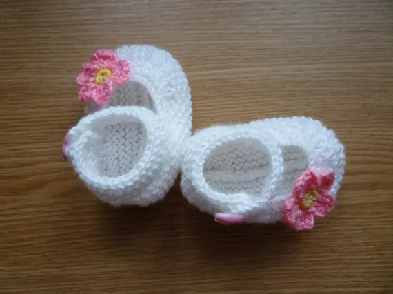 white knitted baby booties