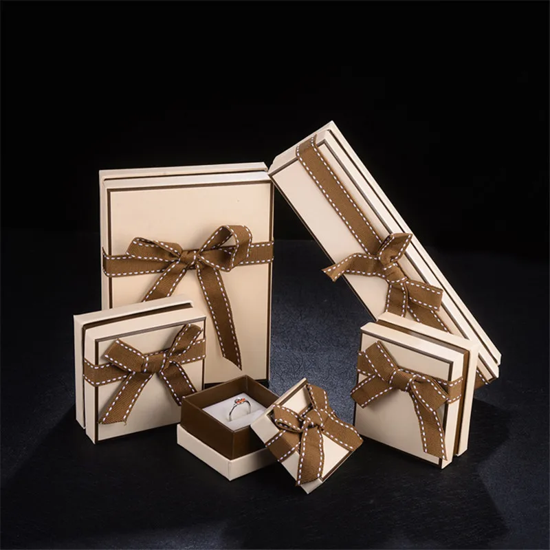 

10pcs/set jewelry Box with Brown Bow The Ring / Pendant / Bracelet And long Bracelet paper case More than 100pcs discounts