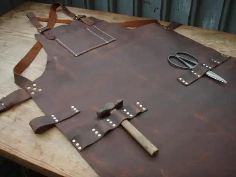 

Genuine Leather Work Apron top pocket plus tool loops oily utility leather that I use gives the apron a rust