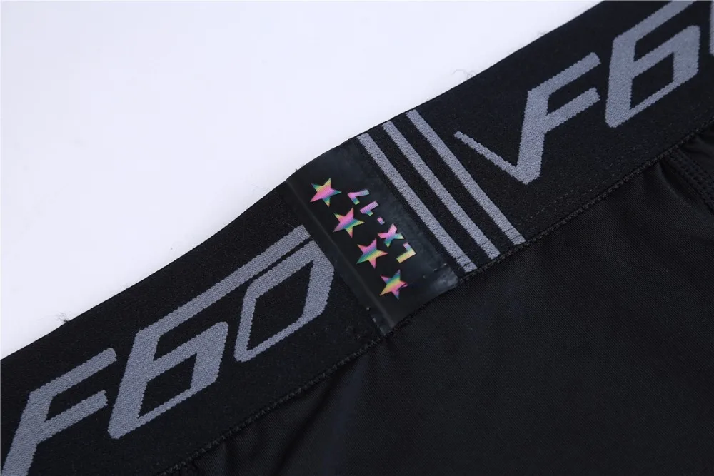 Leggings homme noir rouge ou gris, meggings bicolore réfléchissant yoga gym, détail de la taille élastique, gros plan