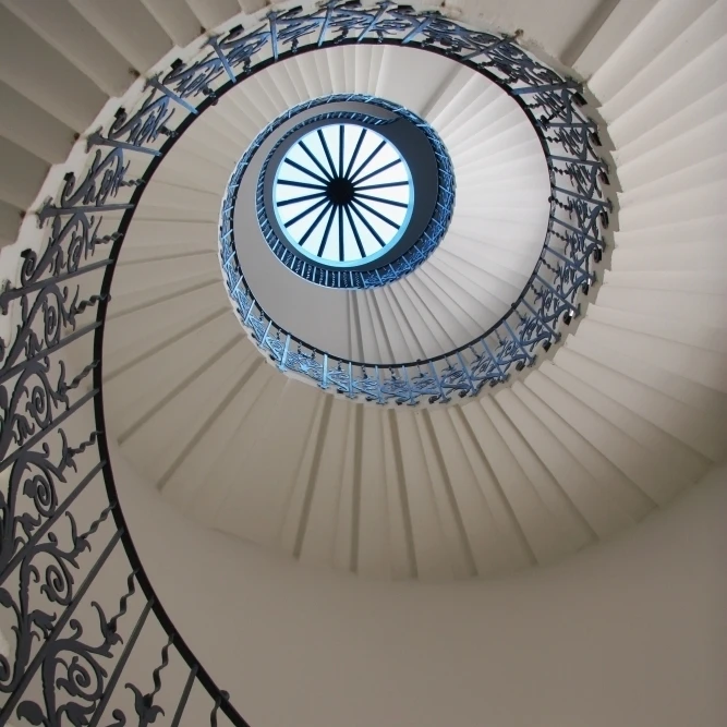 Looking Up At A Spiral Staircase Poster Print (12 x 18)