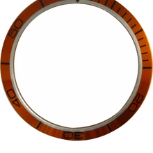 Маленькие оранжевые часы с изображением планеты