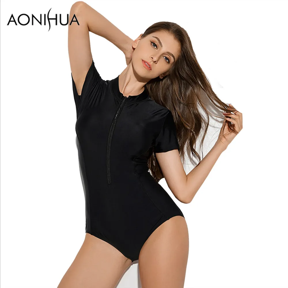 AONIHUA أسود ملابس السباحة المرأة مثير 1 قطعة واحدة ملابس السباحة 2018 قصيرة الأكمام الجبهة زيبر الصلبة الشاطئ تصفح لباس سباحة 1990 XXL