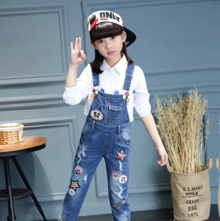 

New Big Girls Denim Overalls Cartoon Letter Pants For Girls Ripped Jeans Spring Kids Trousers Brand Children Jumpsuits 3T - 14T