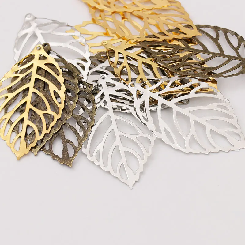 50pcs Craft Hollow Leaves Pendant Jewelry Accessories Gold Charm Filigree Jewelry Making Plated Vintage for Hair Comb Hot New