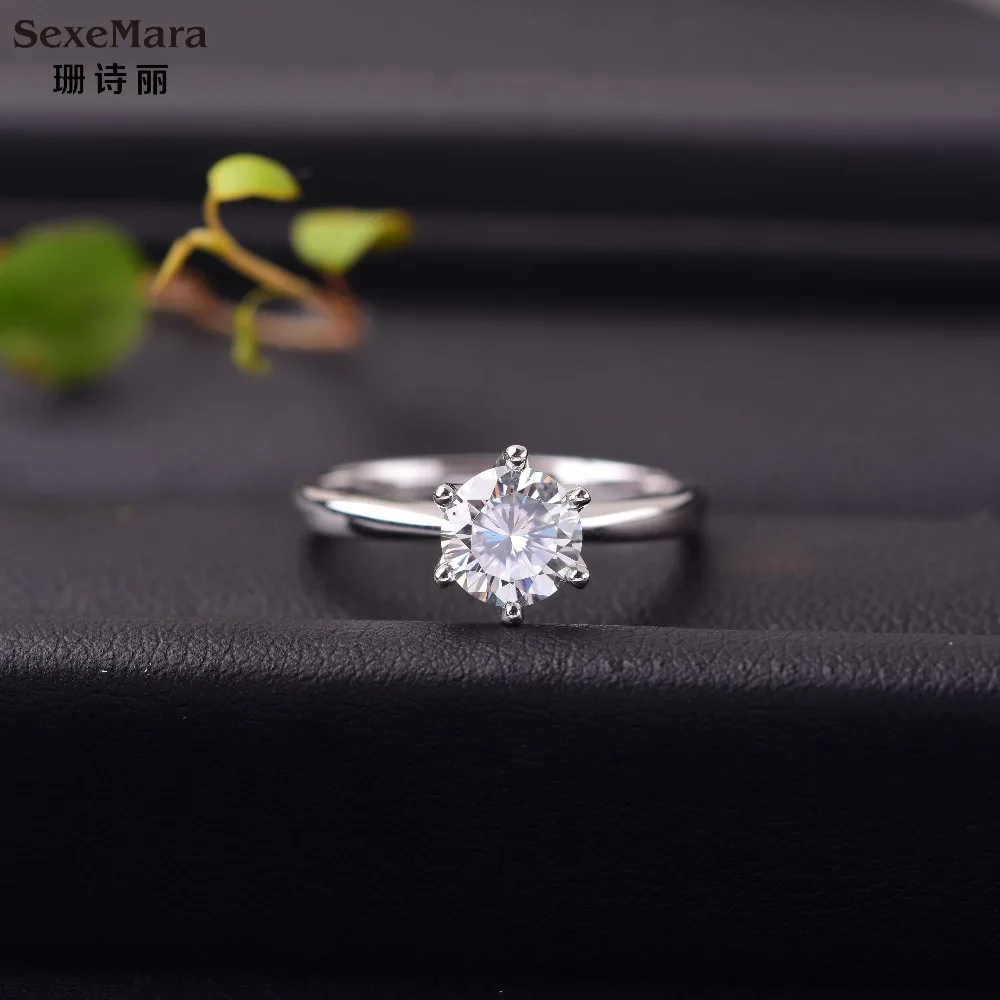 

The ring is made from an 18K White Gold Prong setting Moissanite Diamond Simplicity and elegance
