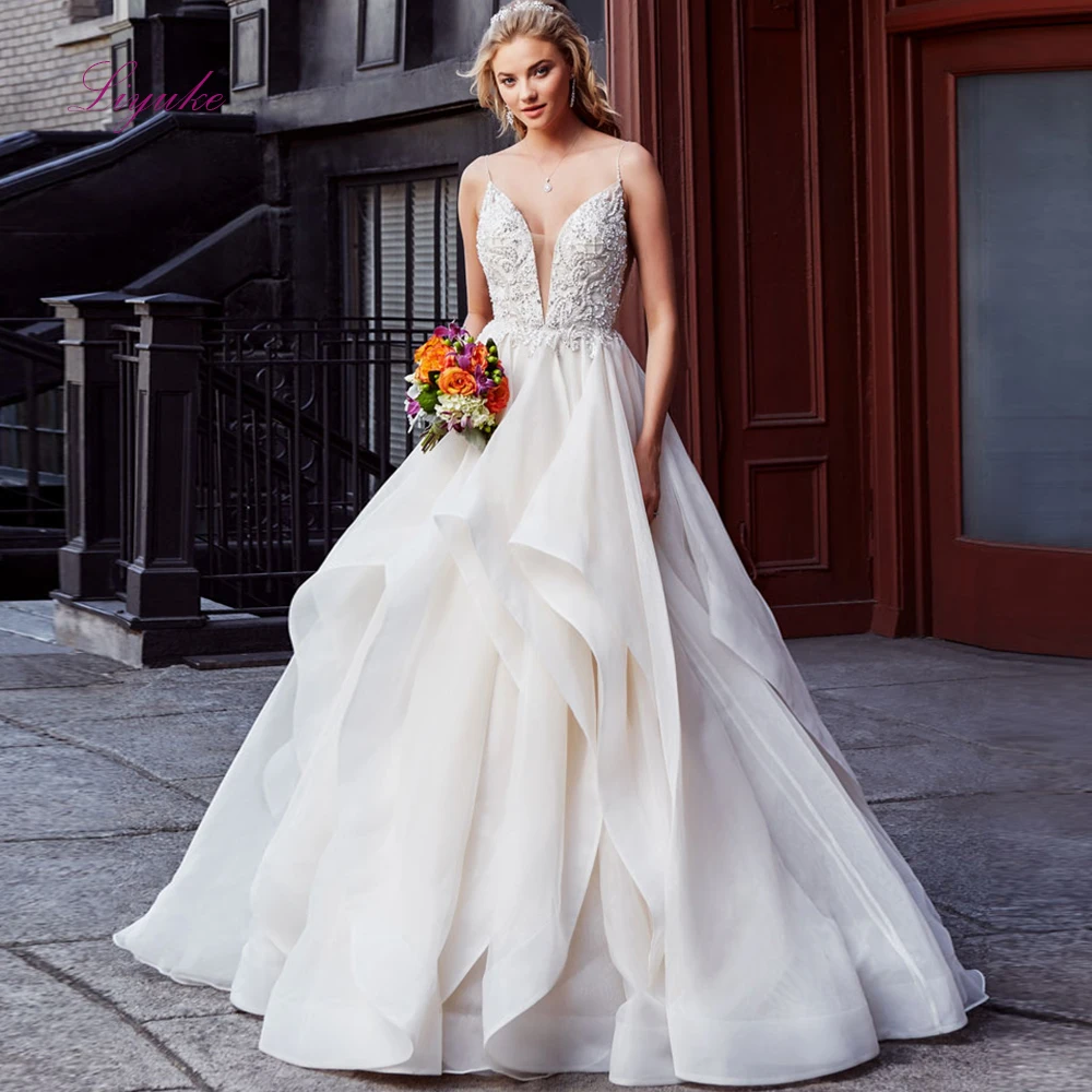 

Liyuke Ball Gown Married Wedding Dress 2019 Spaghetti Straps Lace Beading Appliques Backless Tiered Customized Free Shipping