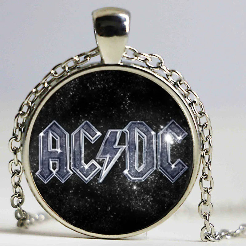 Подвеска в виде рок символа серебристого цвета с музыкальным логотипом группы AC