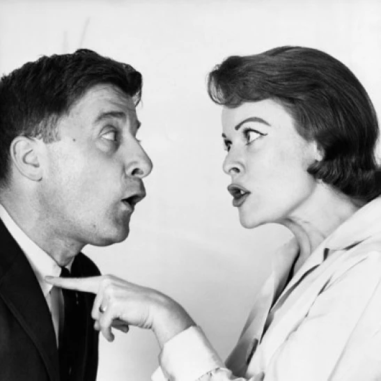 Side profile of a young woman shouting on a young man Poster Print (18 x 24)