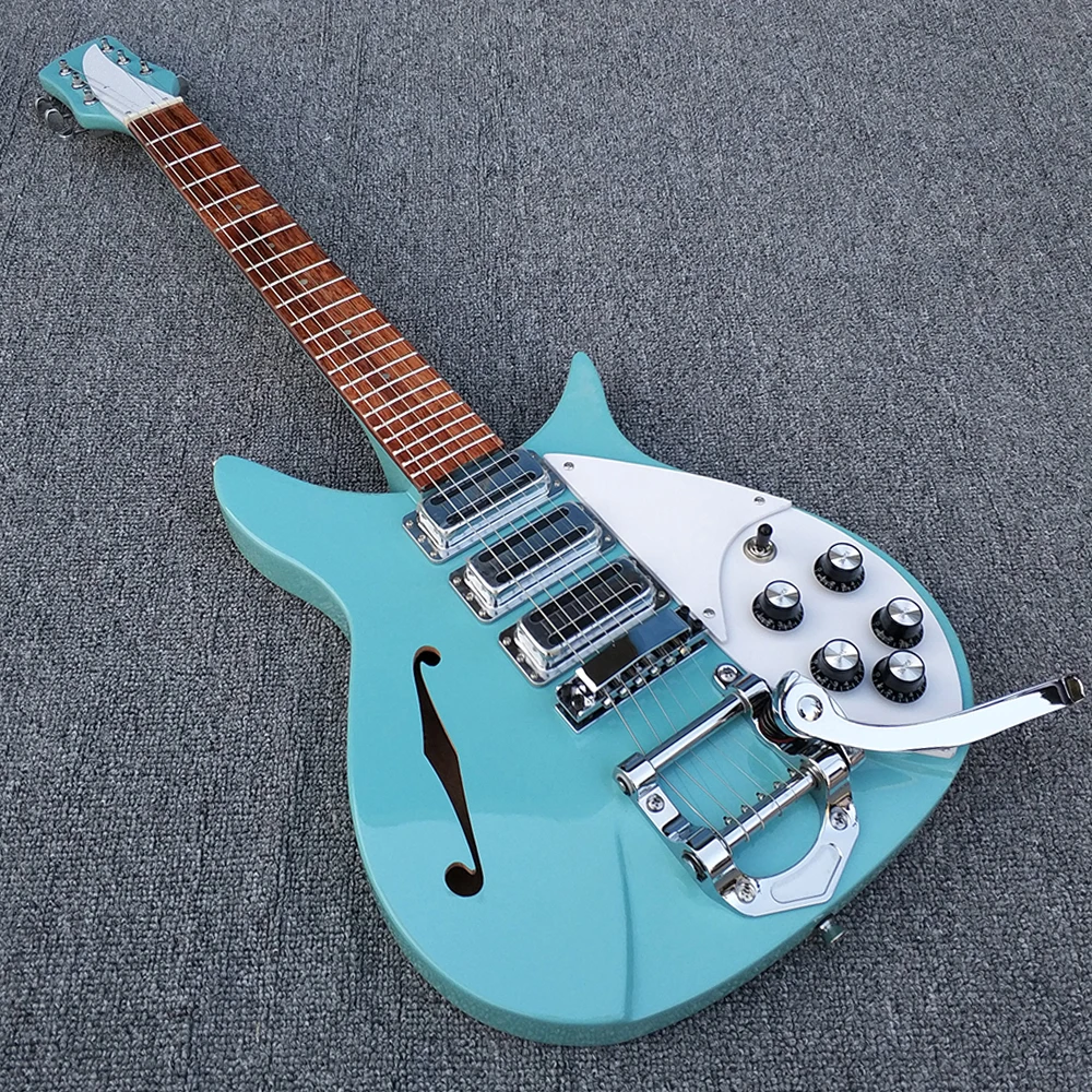 

High quality Three pickup 325 electric guitar,The fingerboard has varnish on it, half-hollow light blue body has a F hole in it.