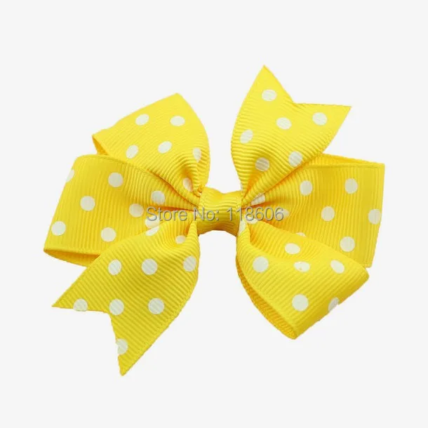 Yellow Polka dot pinwheel hair bow.jpg