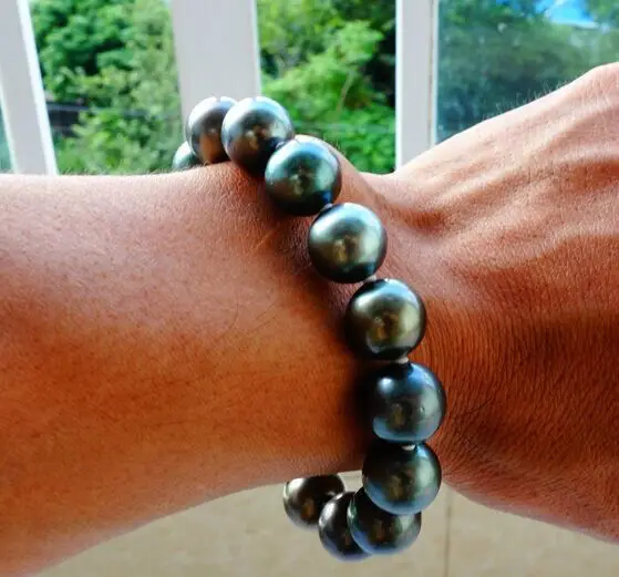 

stunning12mm tahitian round peacock green pearl baracelet 7.5-8inch