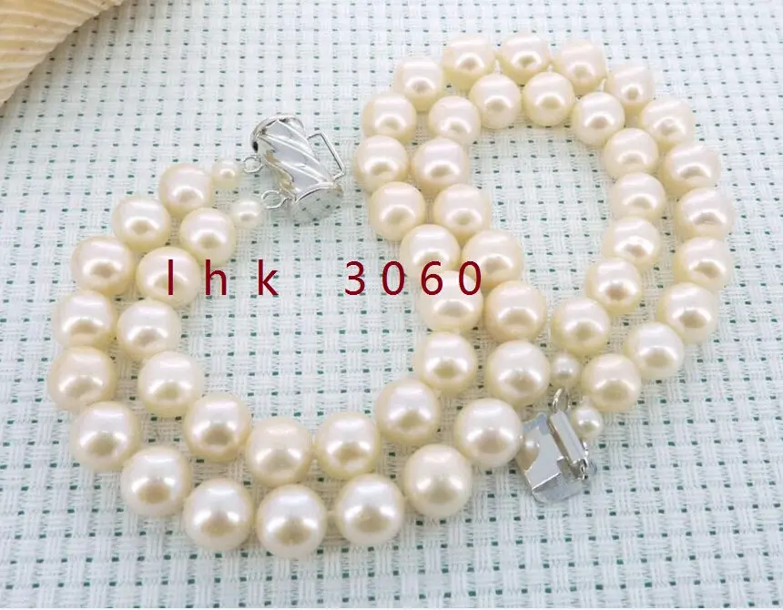 

Free Shipping >>>>>CHARMING 2 ROW NATURAL 9-10MM SOUTH SEA WHITE PEARL BRACELET 14K WHITE GOLD