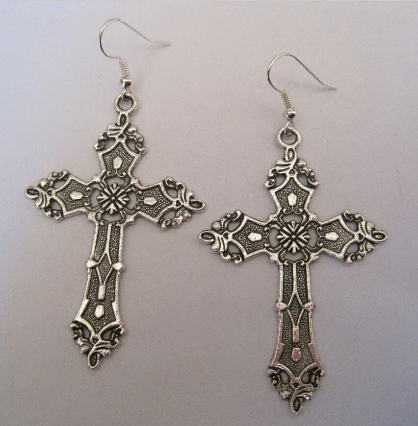 A PAIR OF LARGE SILVER COLOUR CRYSTAL CROSS CRUCIFIX MADONNA EARRINGS NEW.