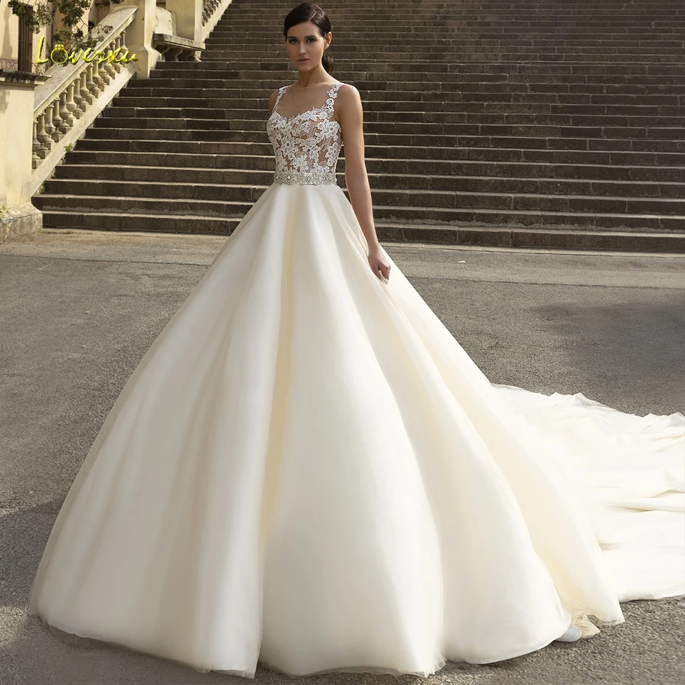 

Loverxu Dreamy Scoop A Line Wedding Dress Delicate Applique Beading Tank Sleeve Backless Bride Dress Cathedral Train Bridal Gown