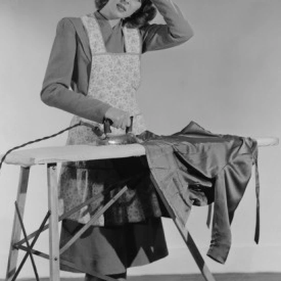 Portrait of housewife ironing Poster Print (18 x 24)