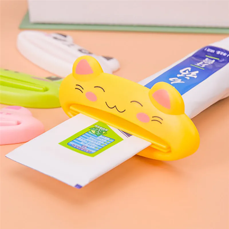 ISHOWTIENDA 1PCS 9cm x 4 cm Cute Animal Bathroom Home Tube Rolling Holder Toothpaste Squeezer Easy Cartoon Toothpaste Dispenser