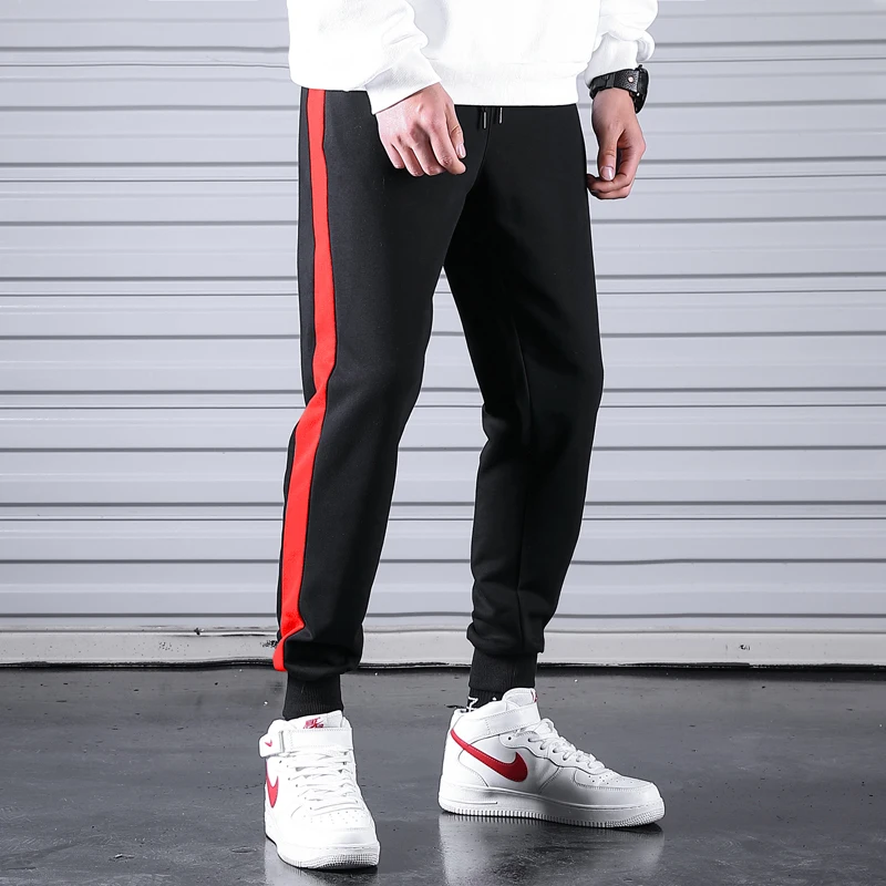 Tanie 2019 męskie spodnie dresowe na co dzień Fitness Side Stripe męskie sportowe spodnie joggery bawełniane nowe męskie siłownie spodnie Pantalones Hombre