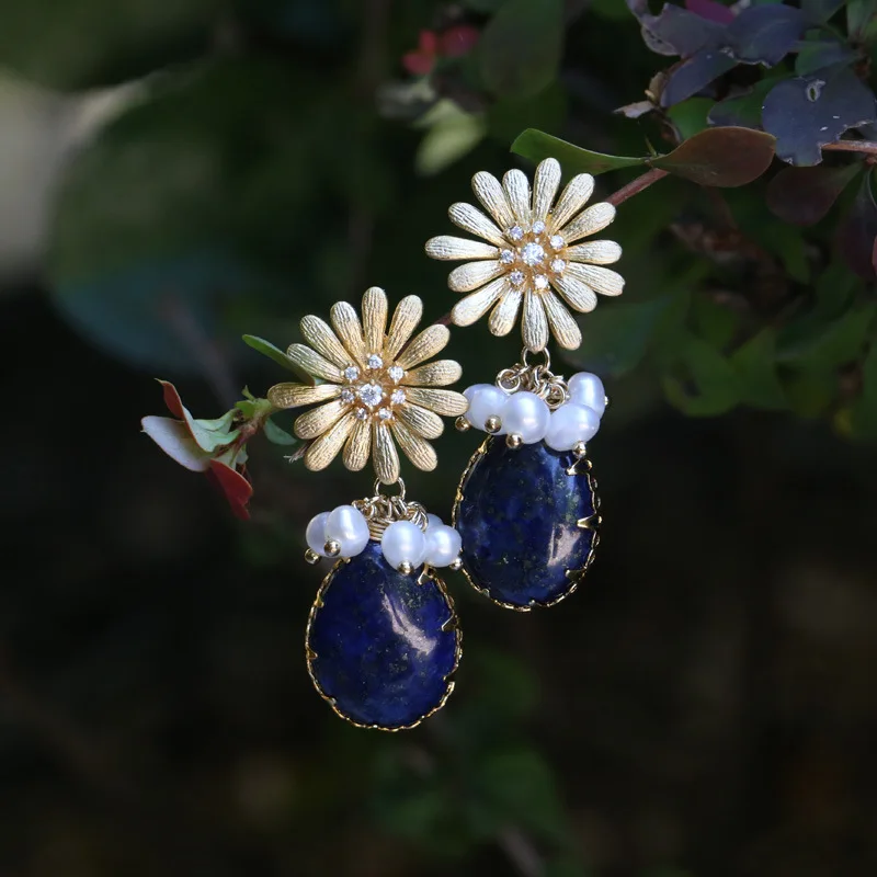 

The designer hand inlaid Pearl Earrings