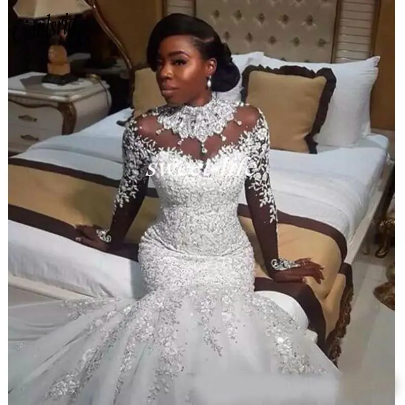 Luxe Afrikaanse Witte Mermaid Trouwjurken Arabische Plus Size Kant Bruidsjurken Parels Lange Mouwen Trouwjurk Robe De Mariee Luxe Afrikaanse Witte Mermaid Trouwjurken Arabische Plus Size Kant Bruidsjurken Parels Lange Mouwen Trouwjurk Robe De Mariee