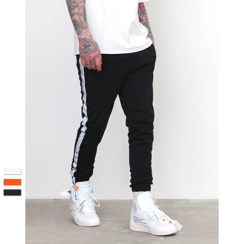 orange and black track pants