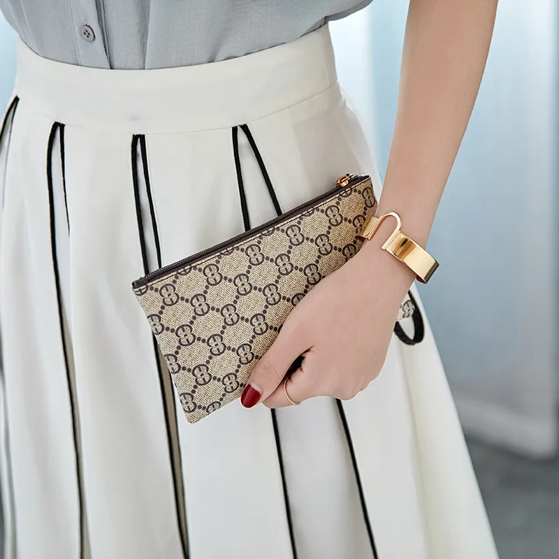 2018 New Well-known Brand Fashion Woman Cosmetic Bags PU Card Mobile Phone Money Travel Organizer Clutch Bag Casual Evening Bag