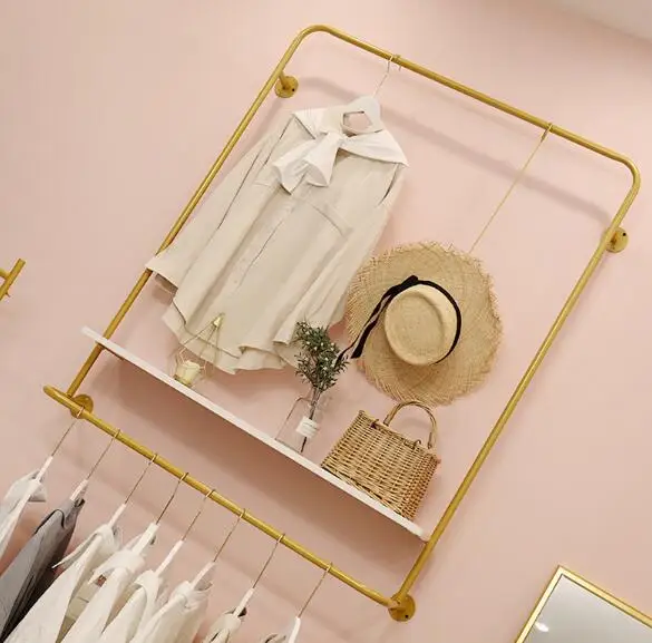 Clothing store wall hanger display rack Nordic women's clothing store wall hanging clothes display rack gold simple.