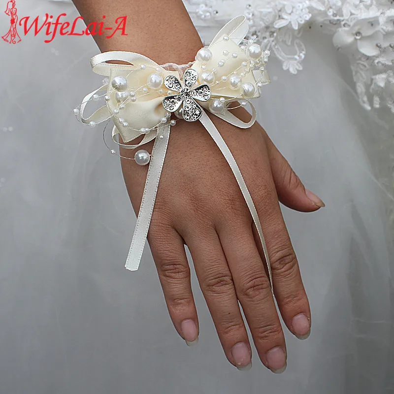 

Wifelai-a Ivory Bow Flowers Pearl Beaded Wrist Flowers Bride Ribbon Crystal Hand Flower Wedding Corsages SW175-Z