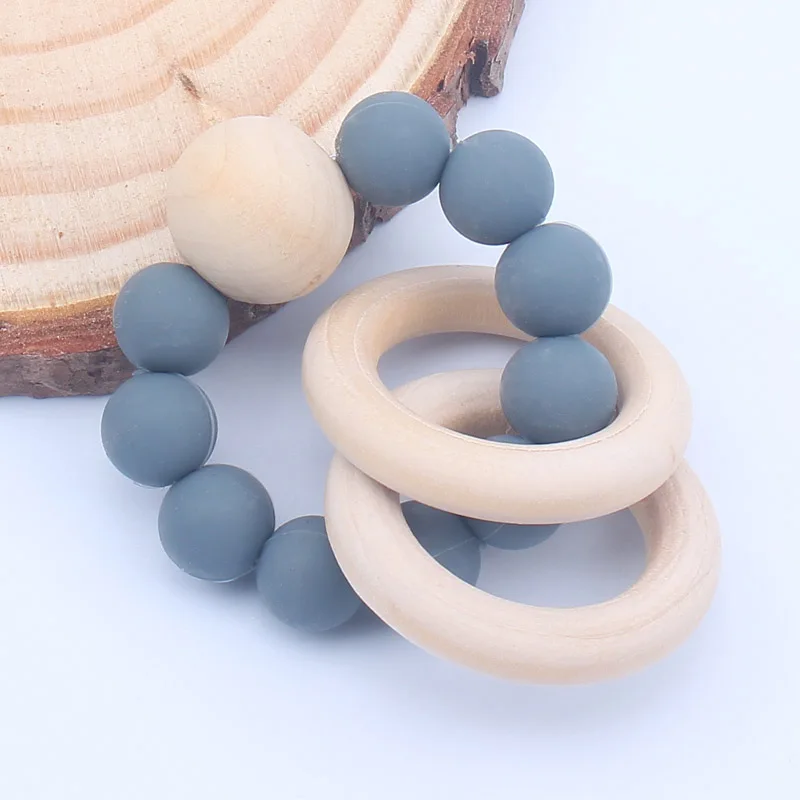 

Baby Nursing Bracelets Silicone Teether Teething Wood Rattles Toys Baby Teether Bracelets Nursing Toys Gift