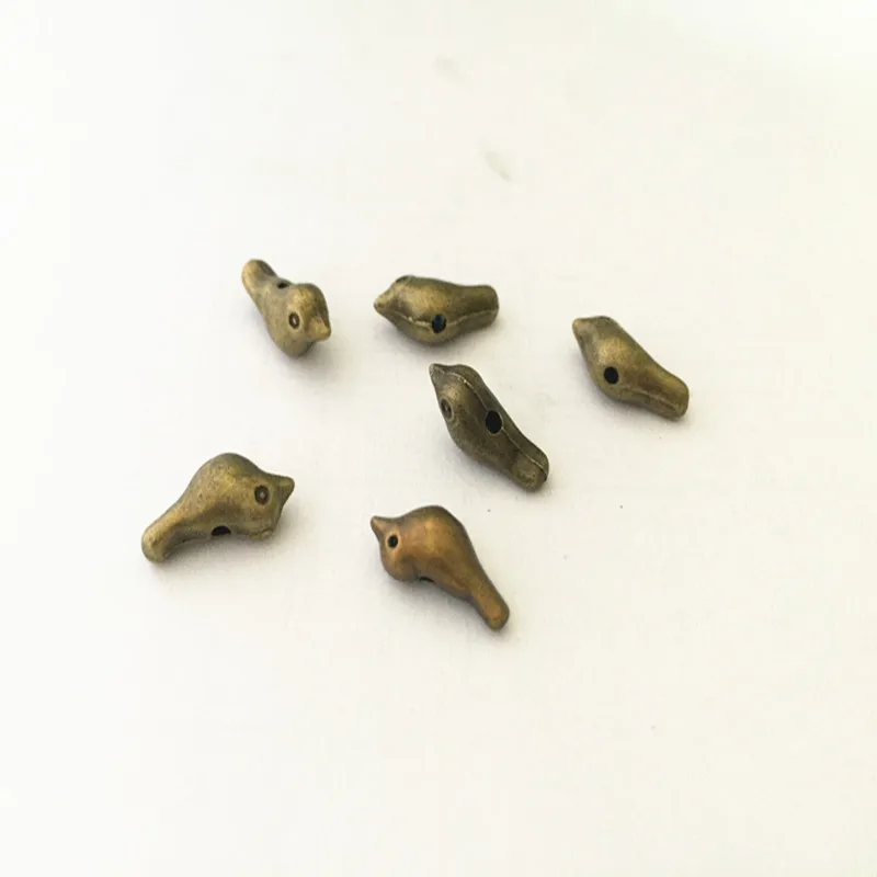 

10Pcs/Lot 7mmx16mm Antique bronze bird pendant charm Necklace Pendant DIY Charm Vintage Mini Charm connector