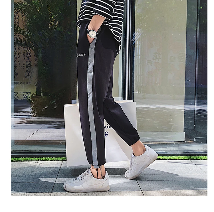 2018 летние Мужская Мода хип-хоп Стиль световой боковая полоса эластичный пояс пят Брюки свободные Повседневное движения брюки M-5XL